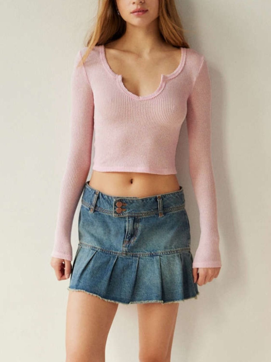 Pink notched long sleeve t-shirt, styled with skirt