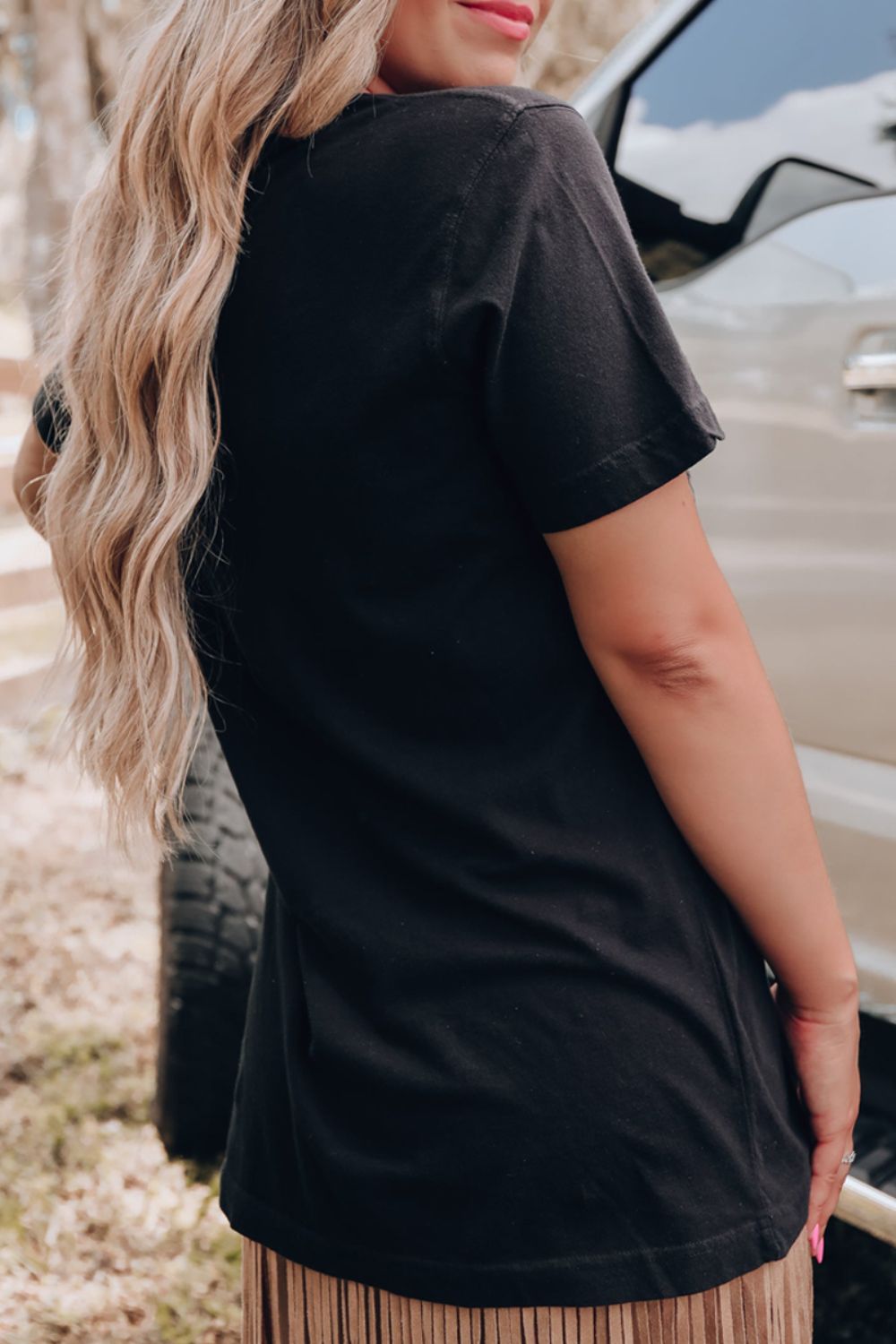 Back view of black graphic round neck short sleeve T-shirt