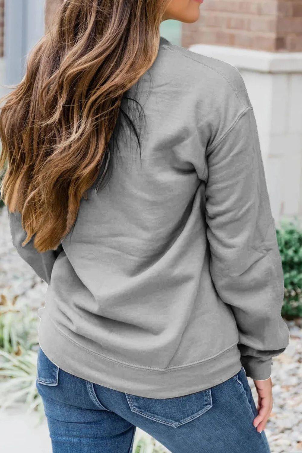 Back view of gray long sleeve sweatshirt