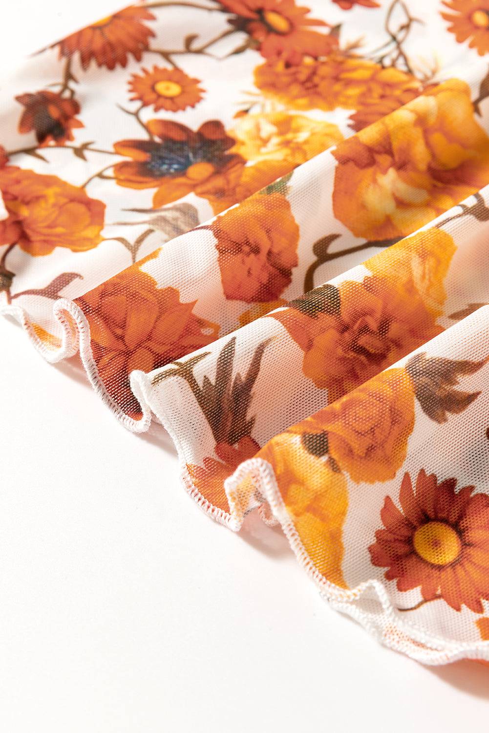 Close-up of floral fabric on mock neck top