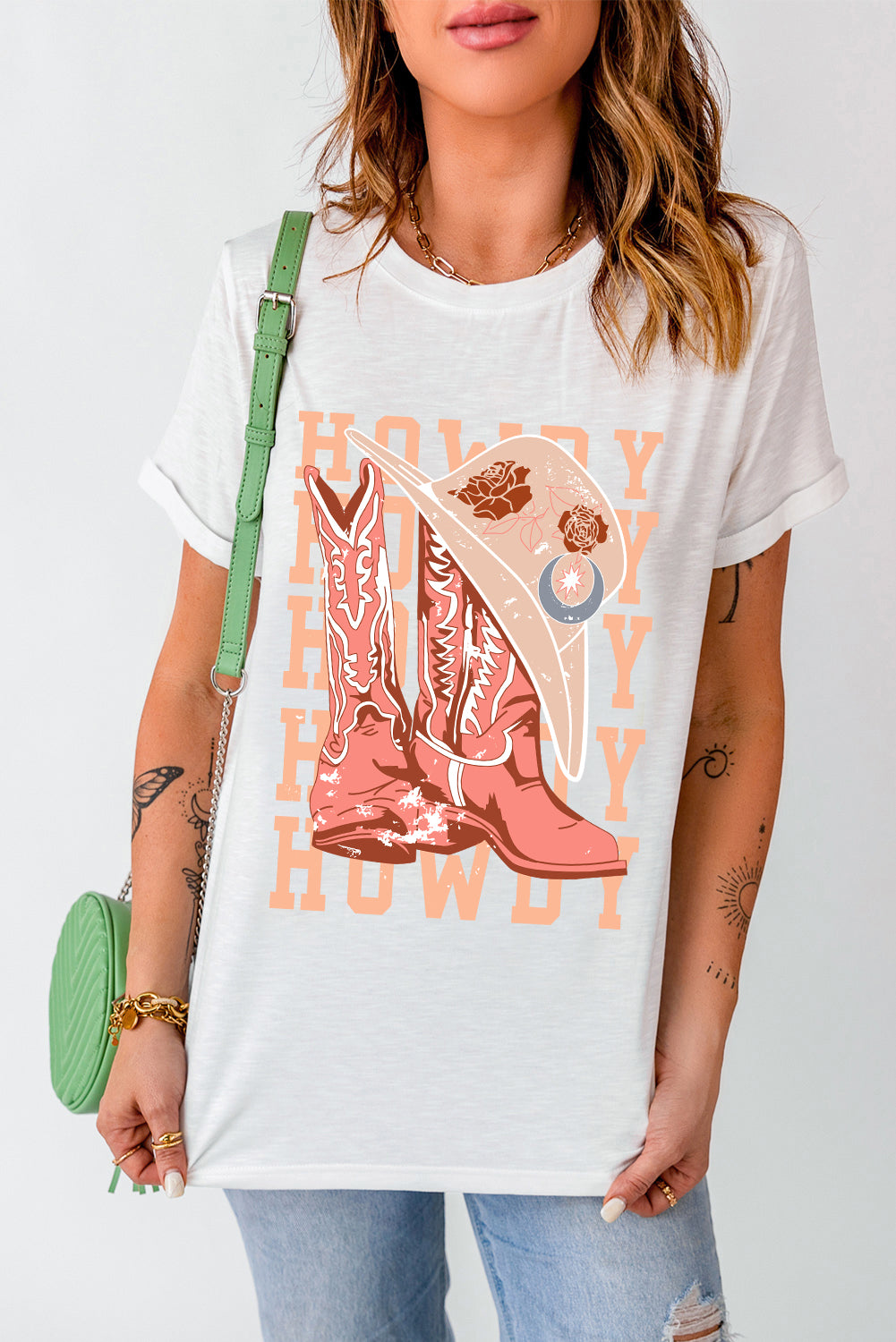 White T-shirt featuring cowboy boots and hat graphic