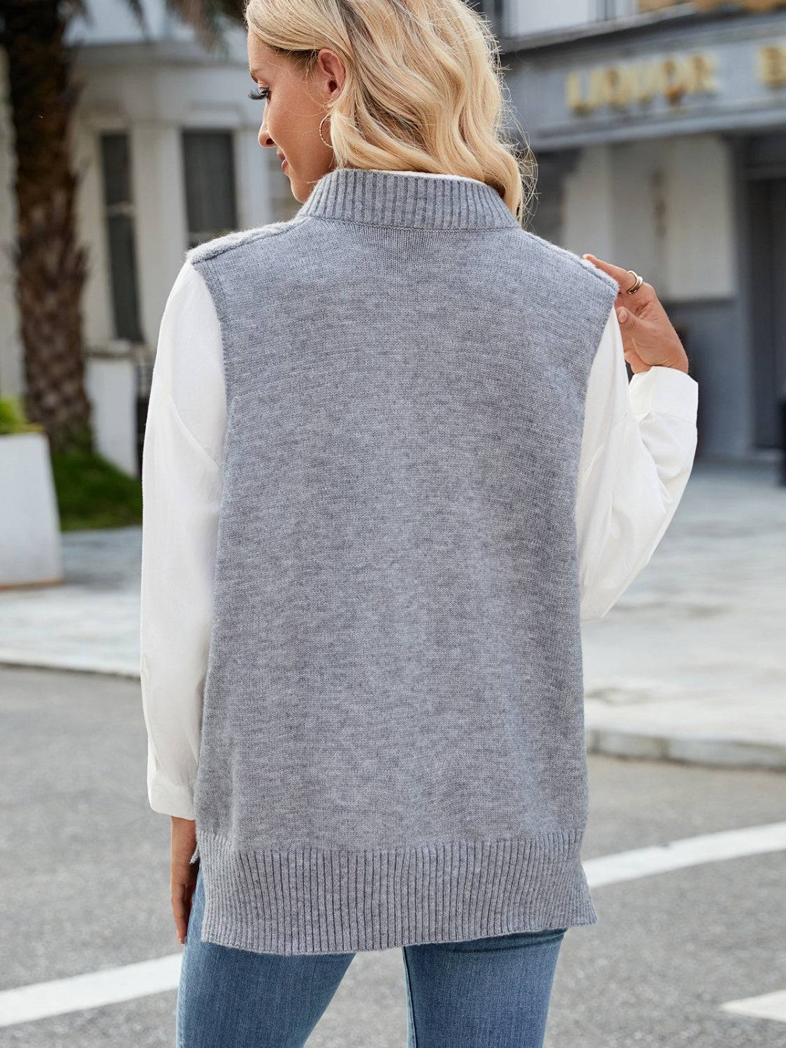 Gray cable knit V-neck sweater vest, back view