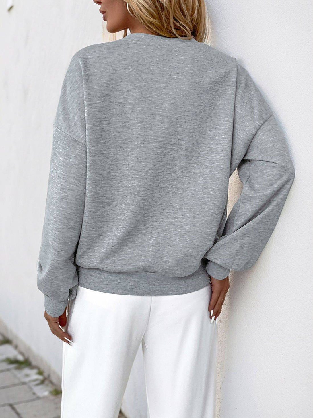 Back view of gray sweatshirt, round neck, long sleeves