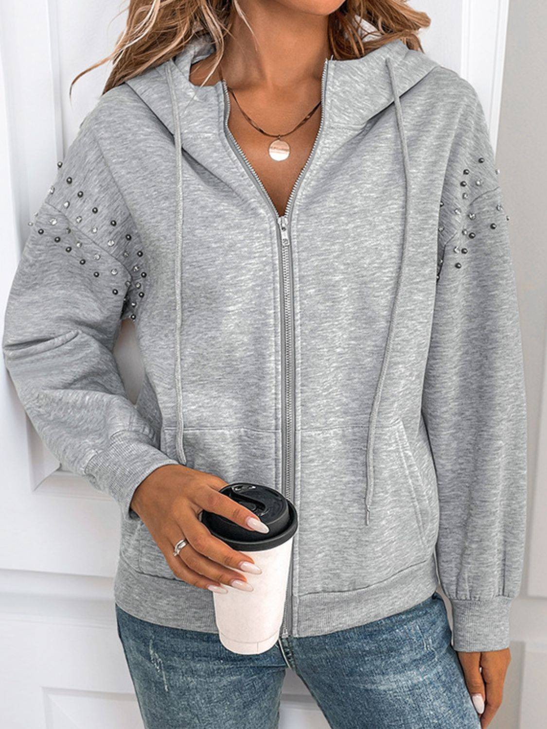 Front view of gray rhinestone hoodie with coffee cup
