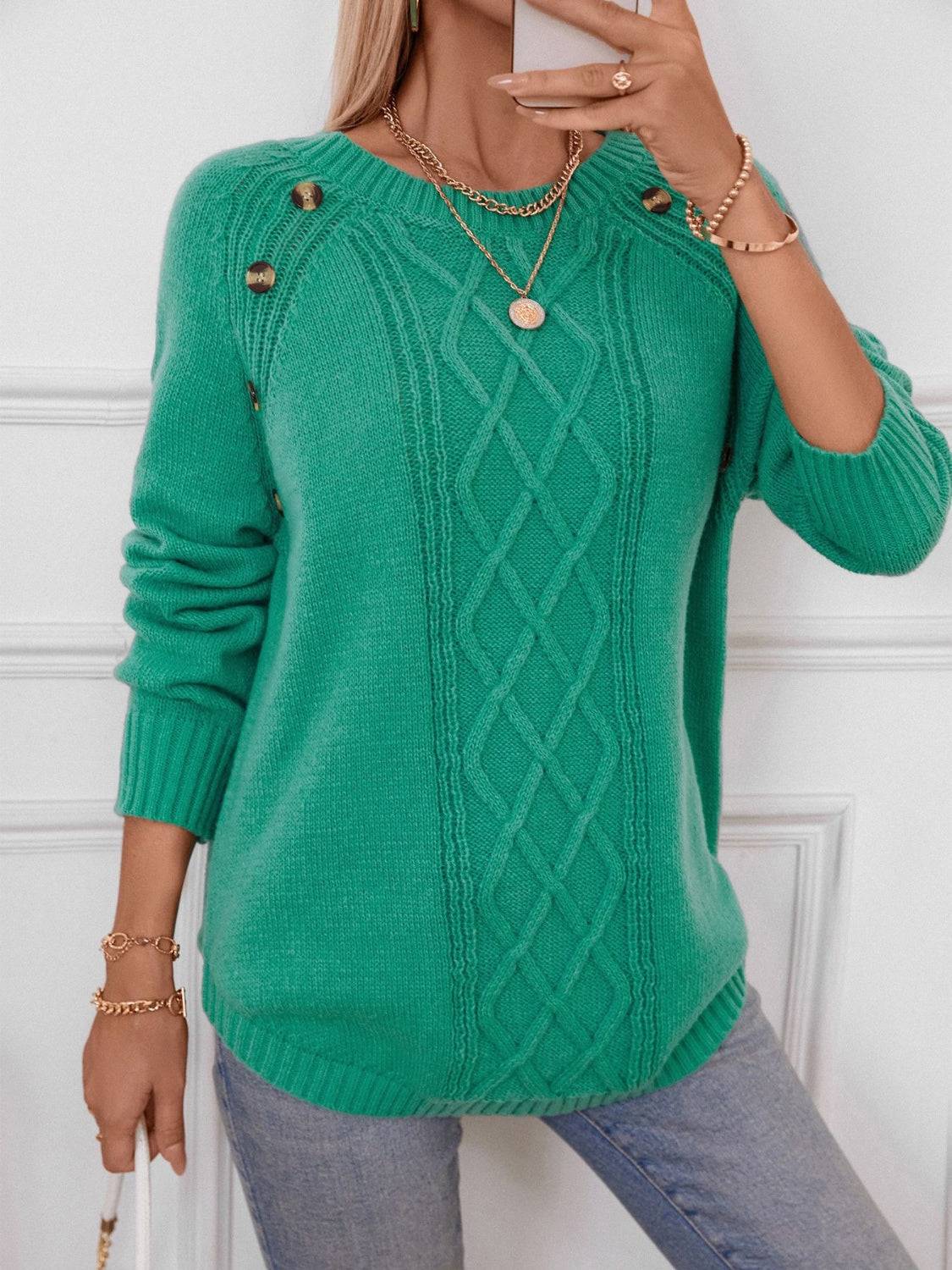 Close-up of green sweater with button details