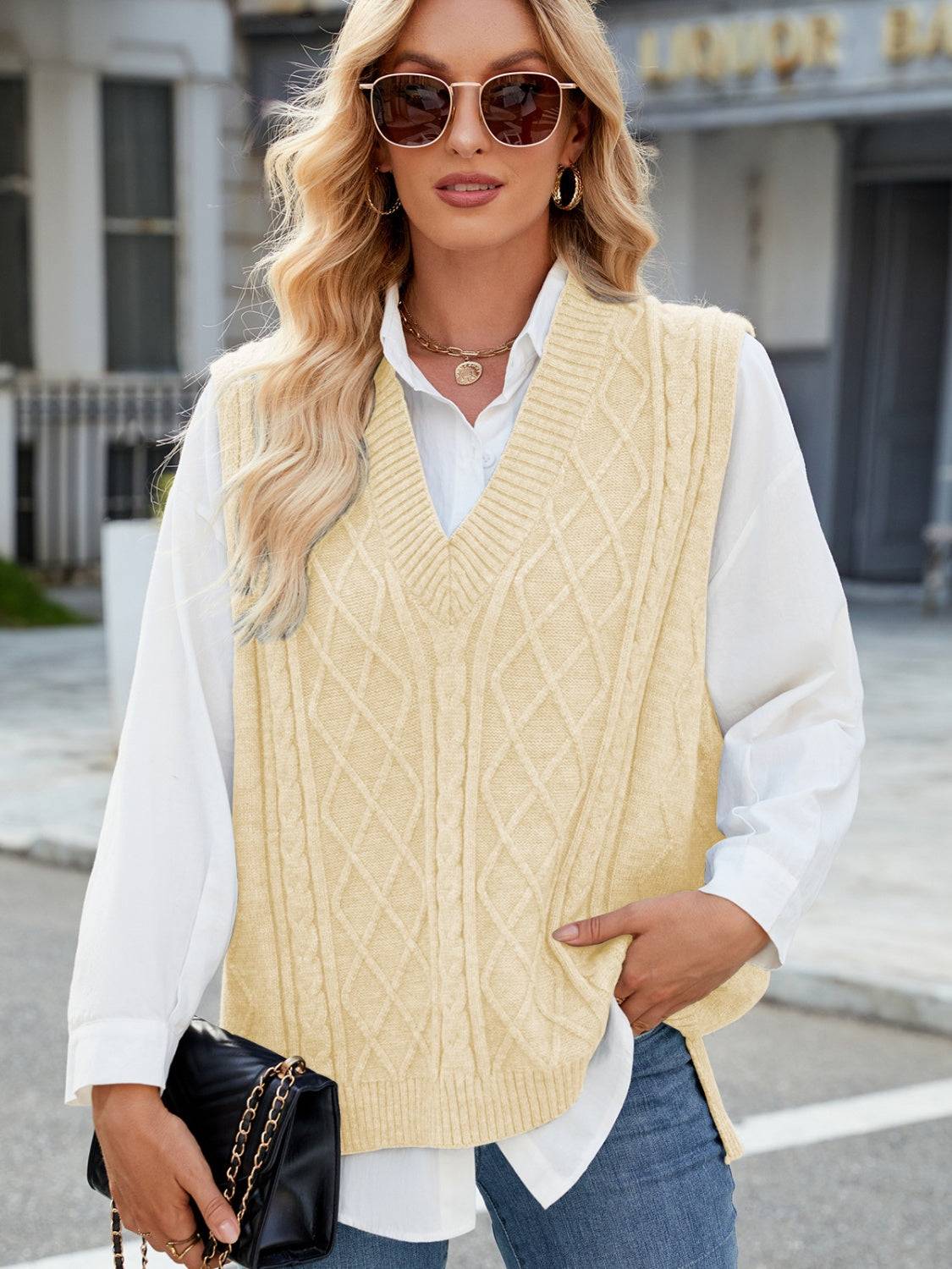 Beige cable knit V-neck sweater vest with sunglasses