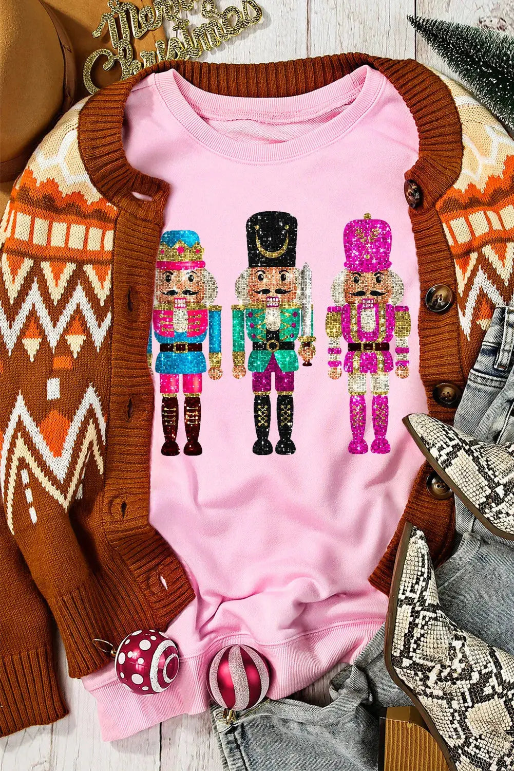 Styled pink nutcracker sweatshirt with accessories