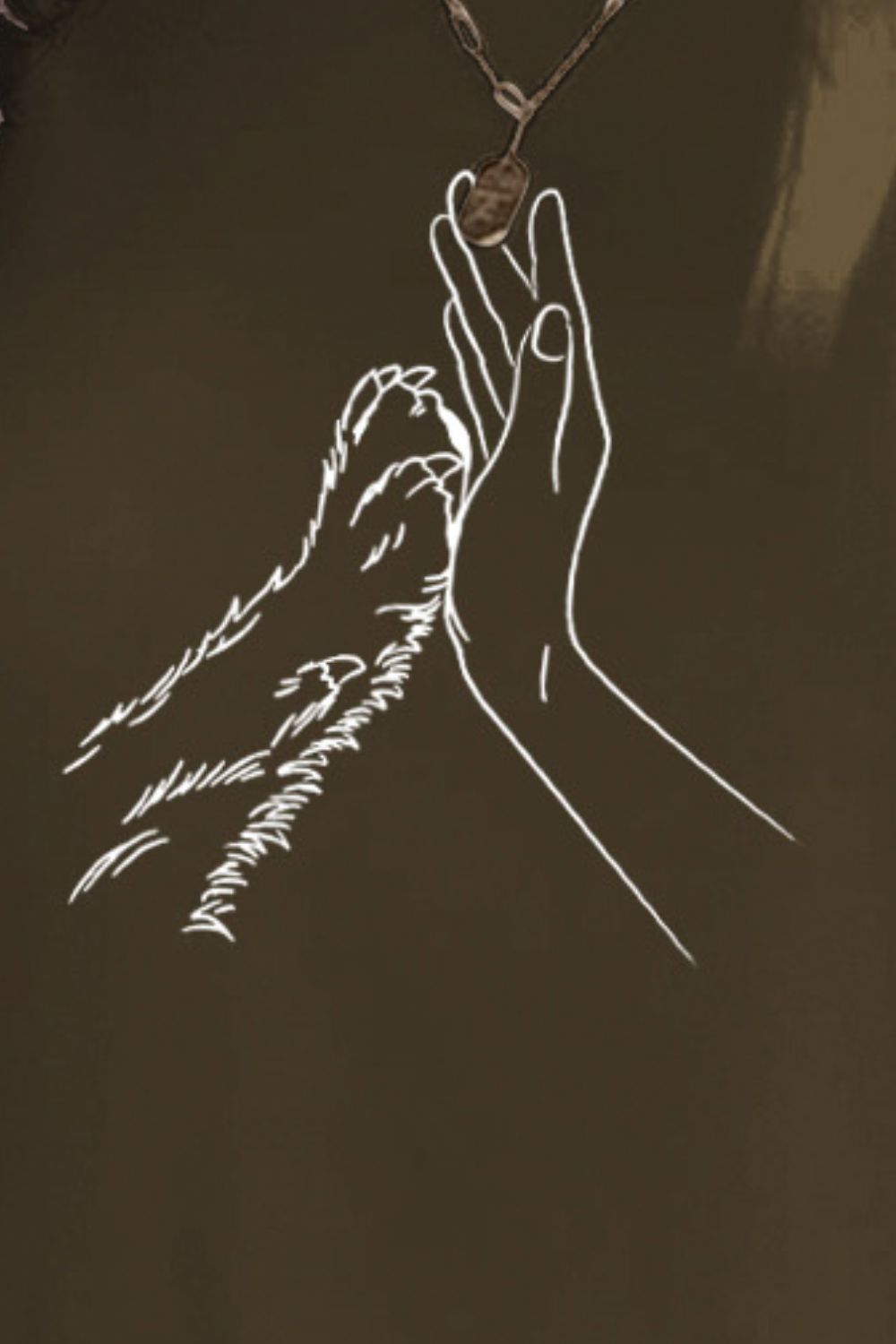 Close-up of hand and paw graphic on dark olive T-shirt