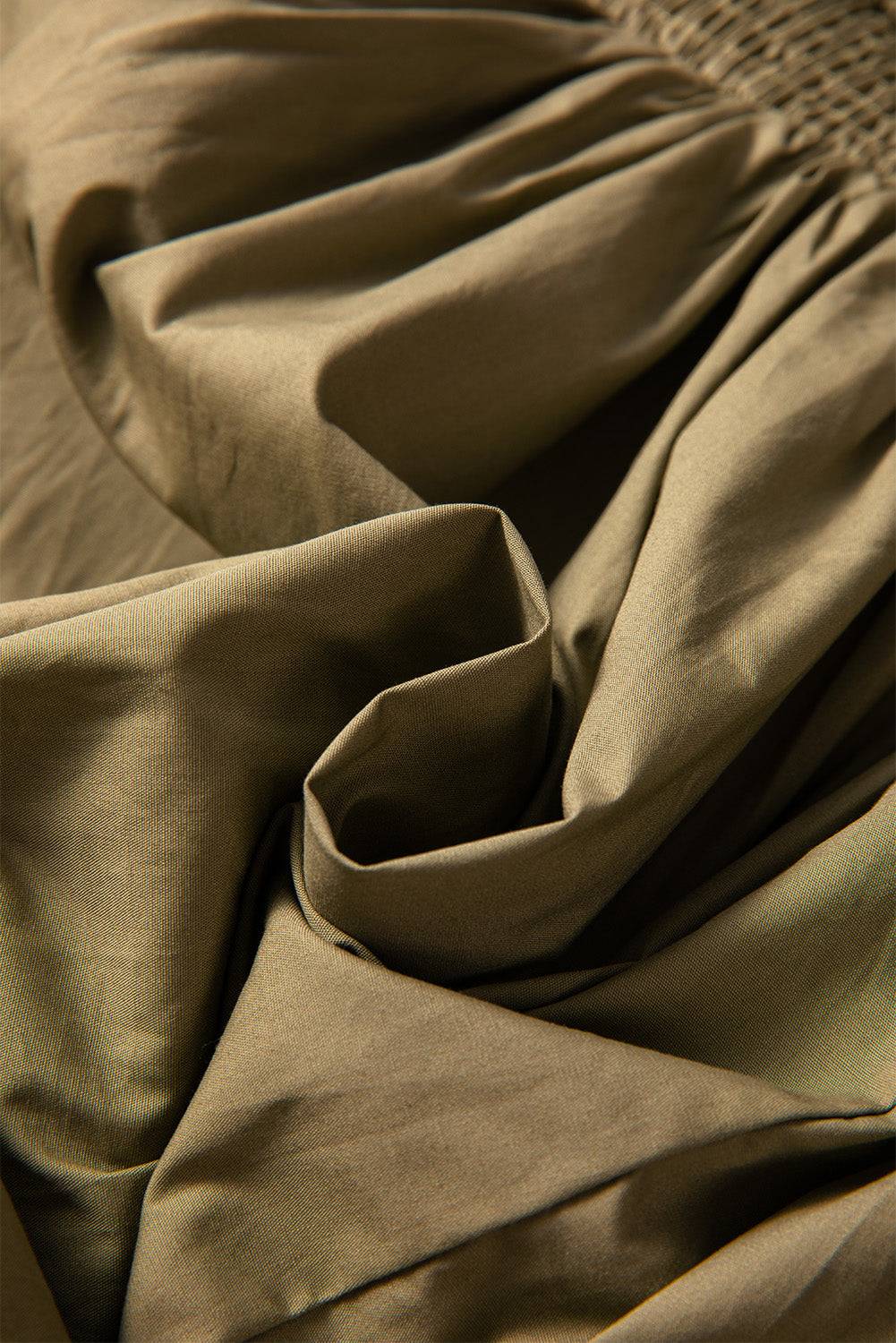 Fabric texture of smocked mini dress