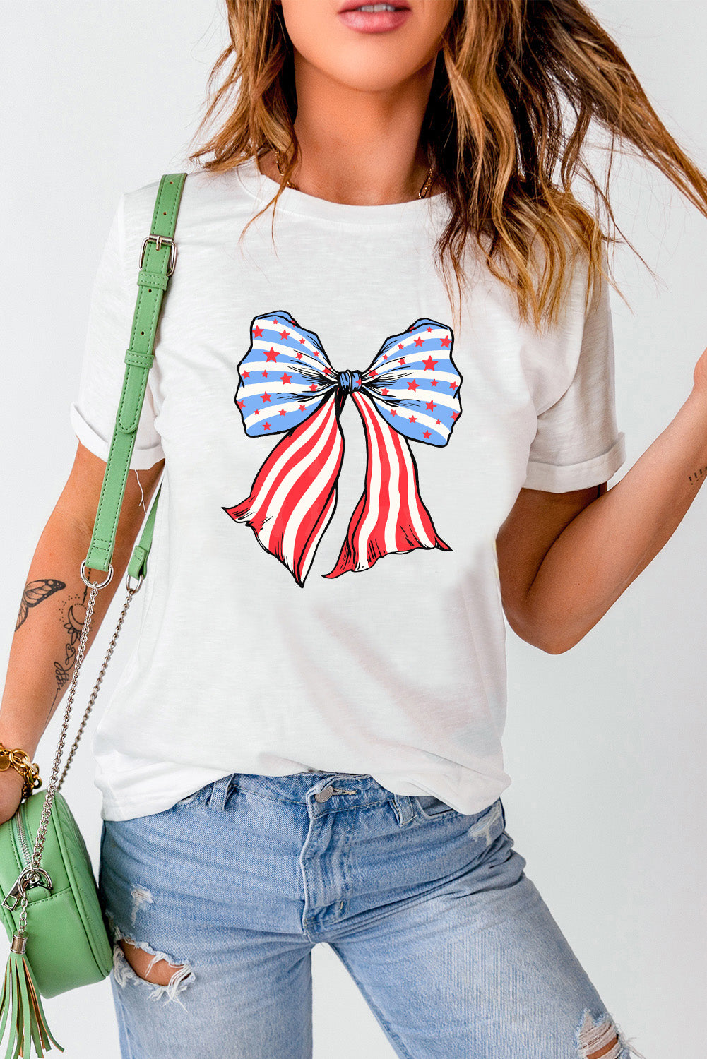 Short sleeve T-shirt with colorful bow graphic design.
