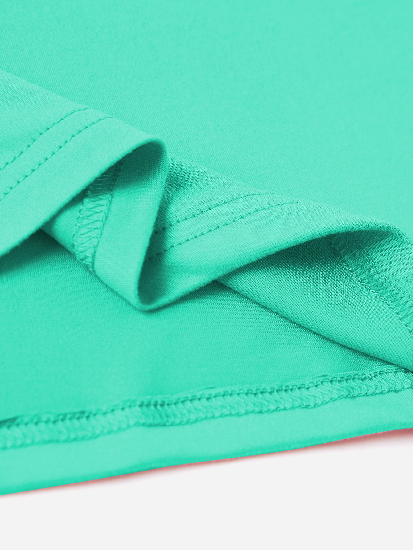 Close-up of mint t-shirt fabric and stitching