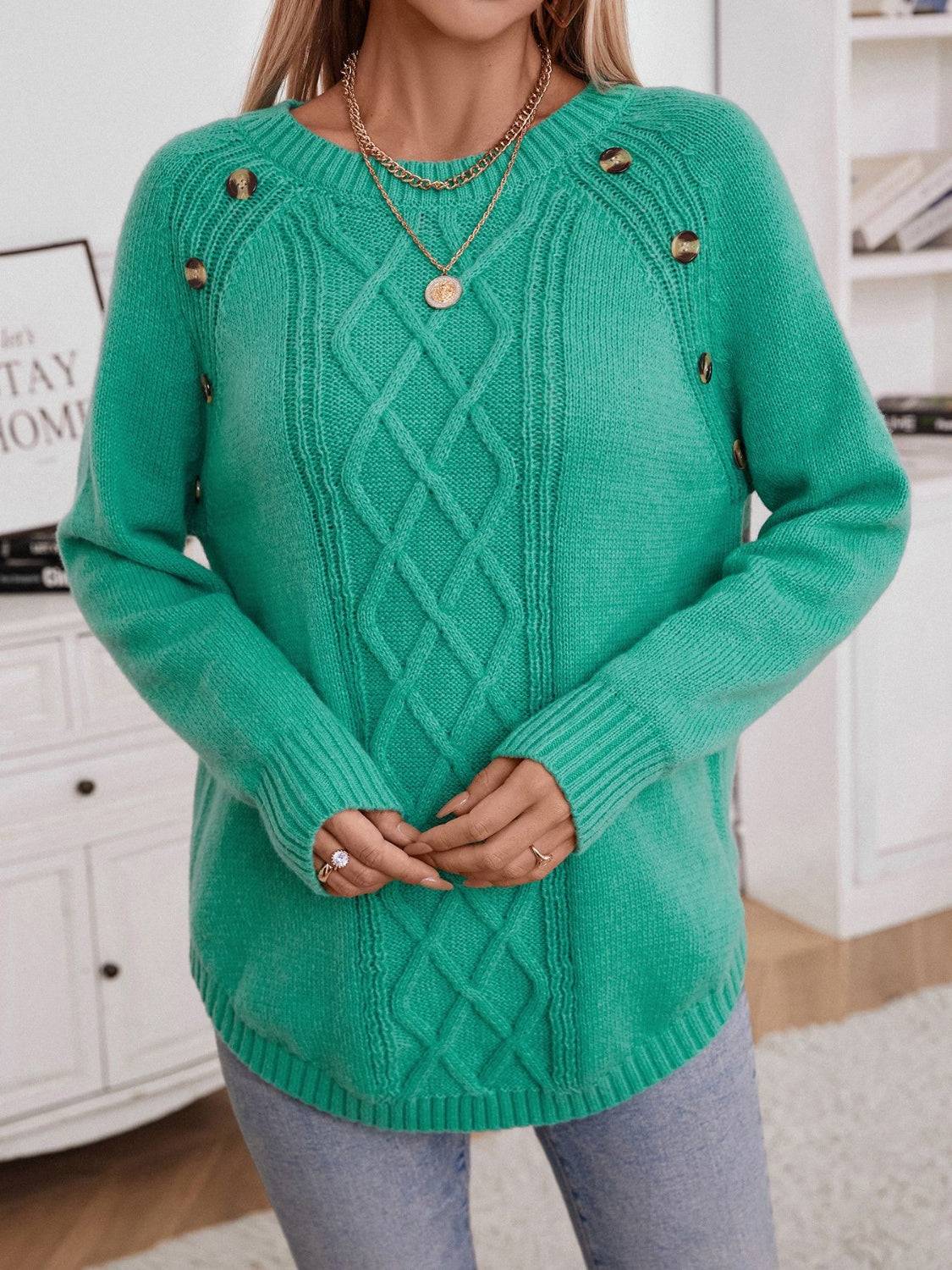 Green sweater with decorative buttons and round neck
