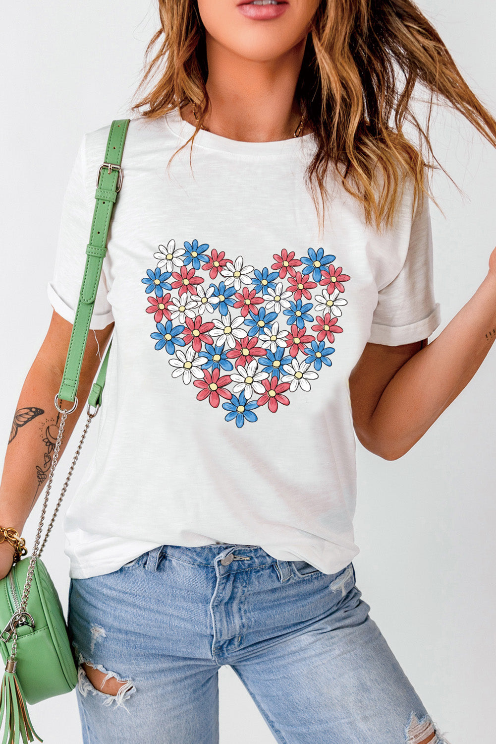 Short sleeve T-shirt with floral heart graphic, casual style.
