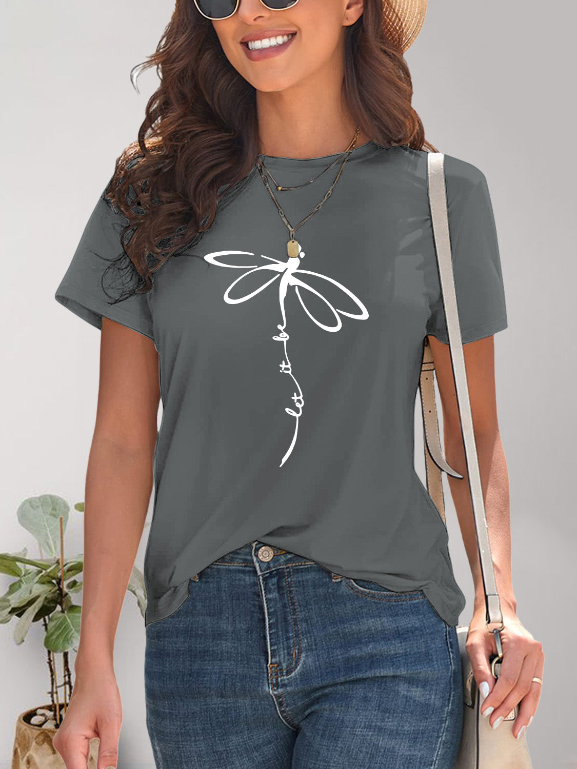 Gray dragonfly graphic t-shirt with accessories