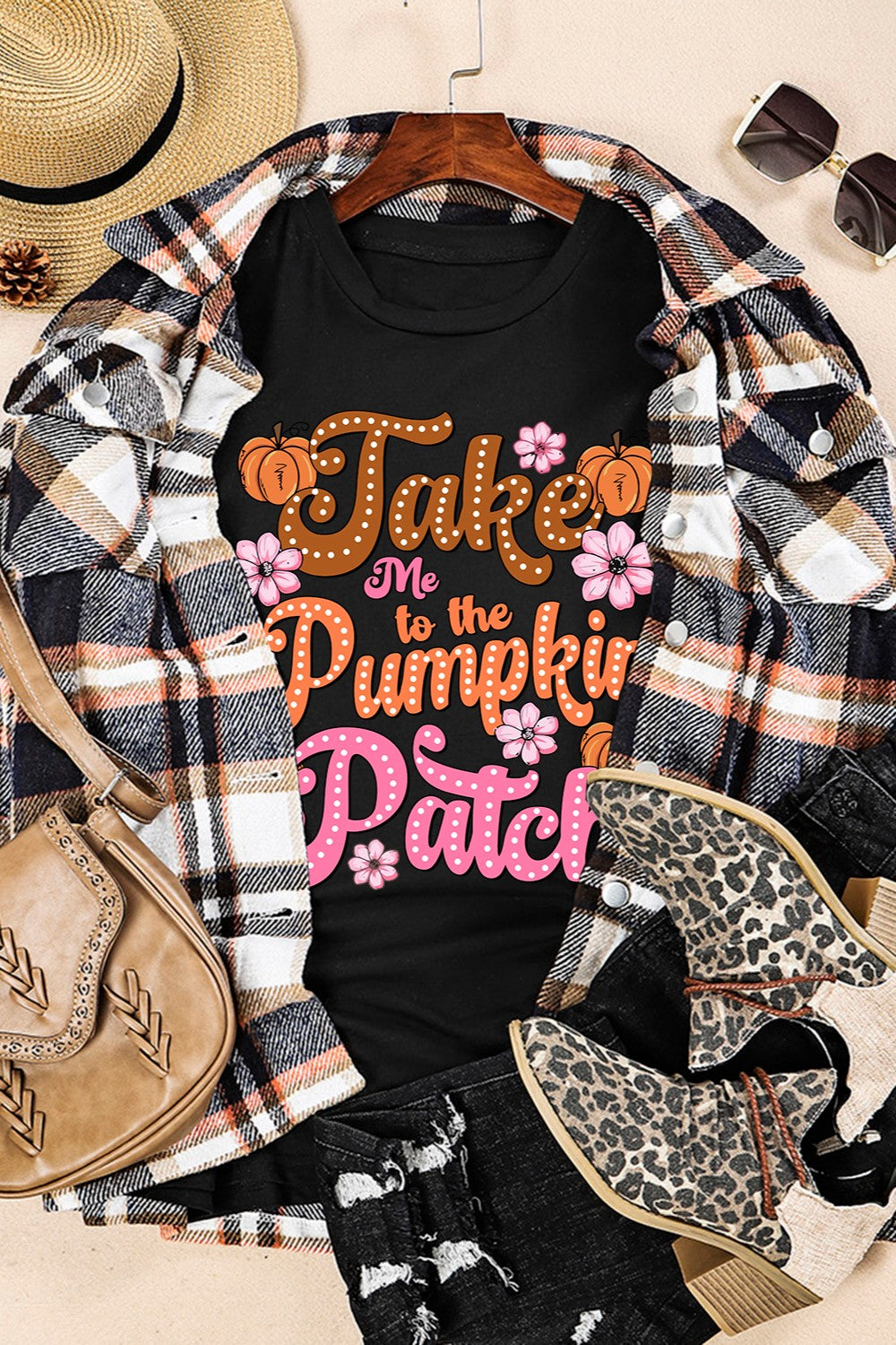 Flat lay of pumpkin patch T-shirt with accessories