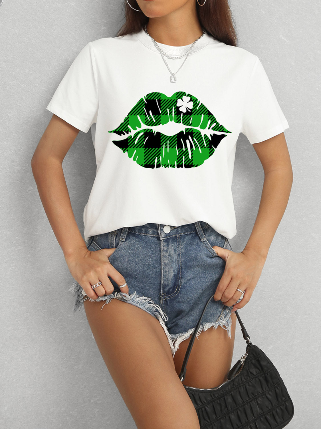 White t-shirt with green plaid lip design