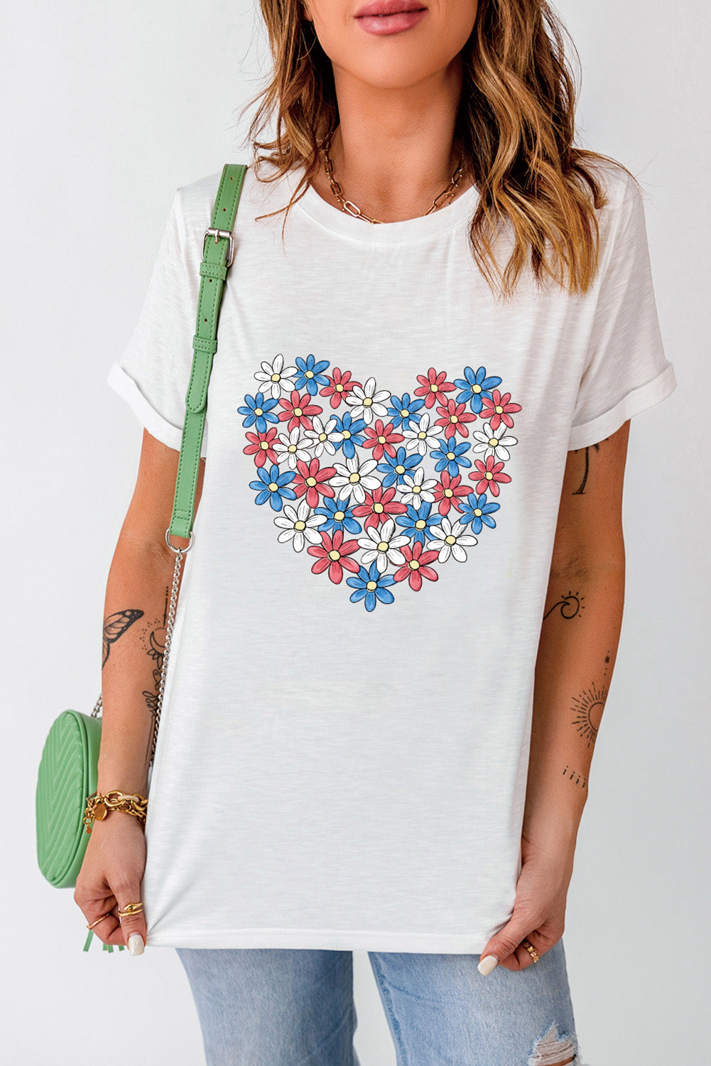 White T-shirt with heart-shaped flower graphic, round neck.