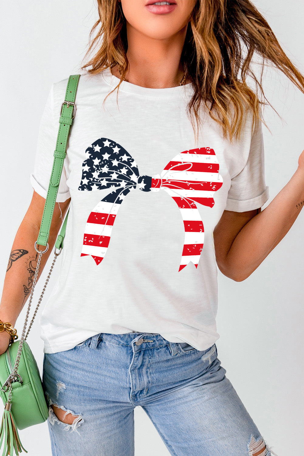 Short sleeve T-shirt with patriotic bow design.