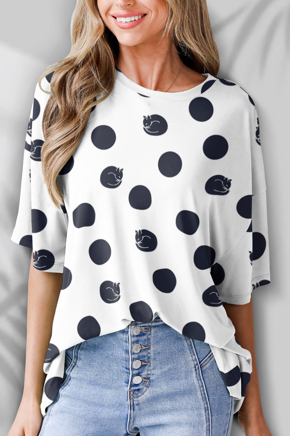 Polka dot t-shirt with cat design on white fabric