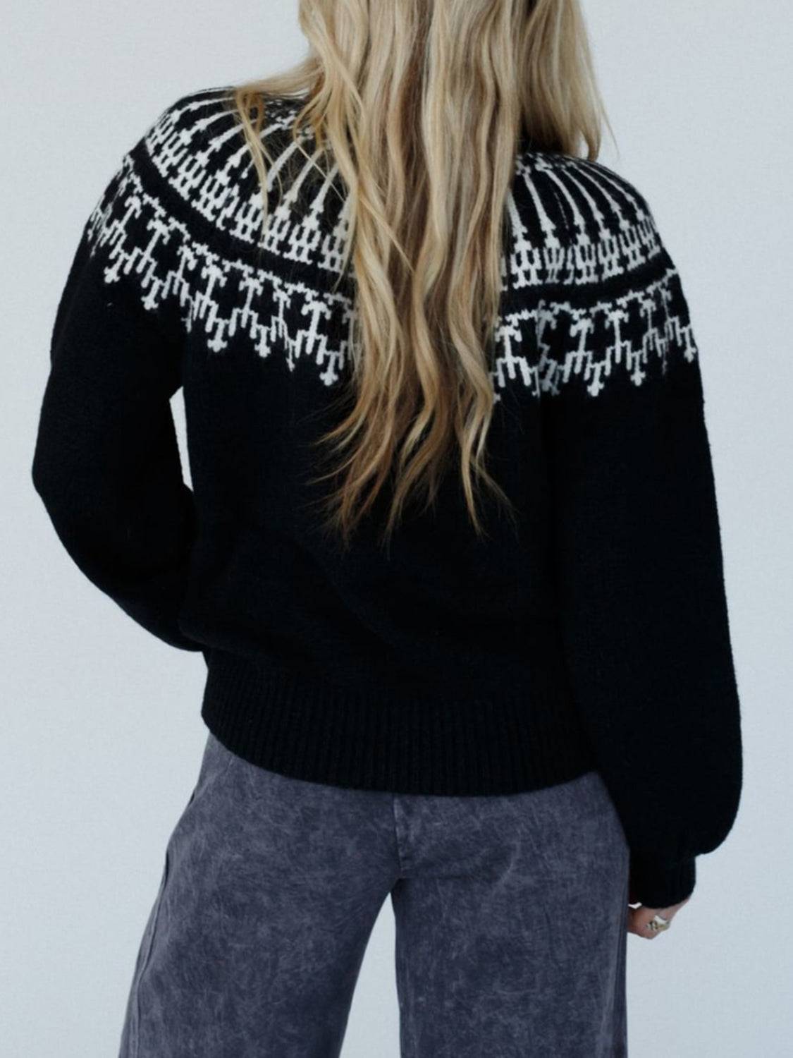 Back view of black contrast turtleneck sweater