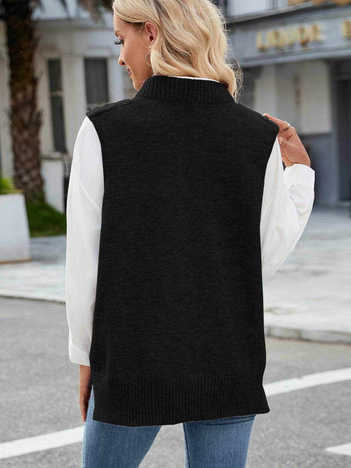 Black cable knit V-neck sweater vest, back view