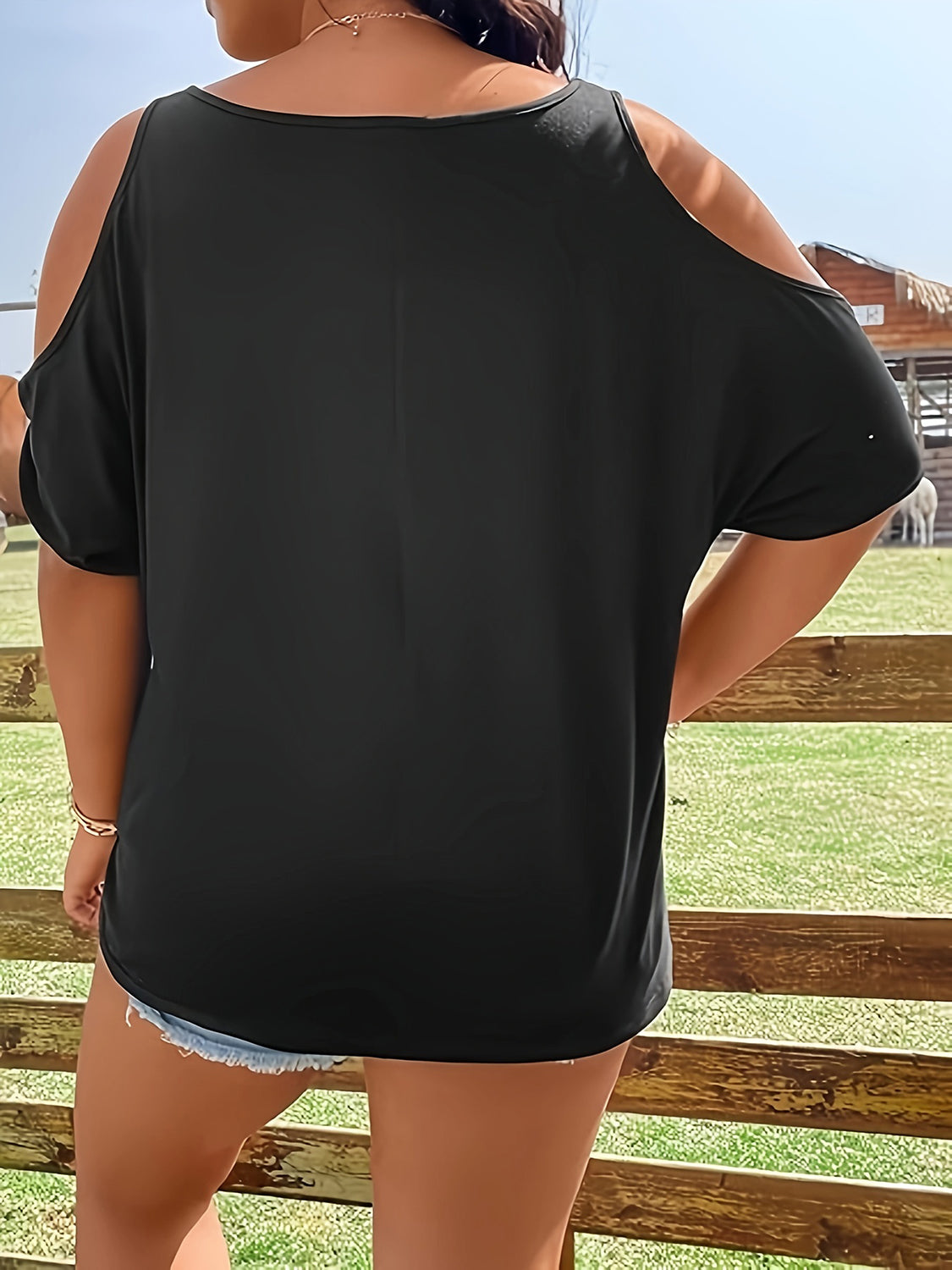Back view of black cold shoulder T-shirt