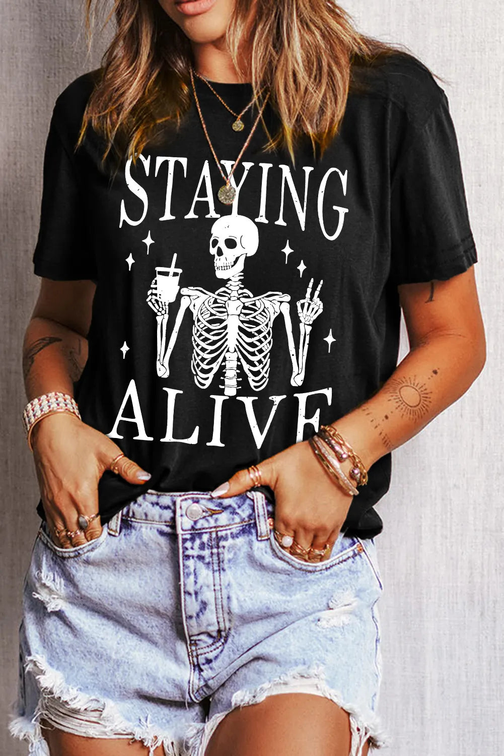 Front view of black T-shirt with skeleton graphic