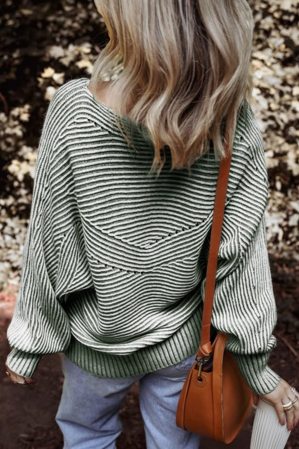 Back view of green textured striped long sleeve top