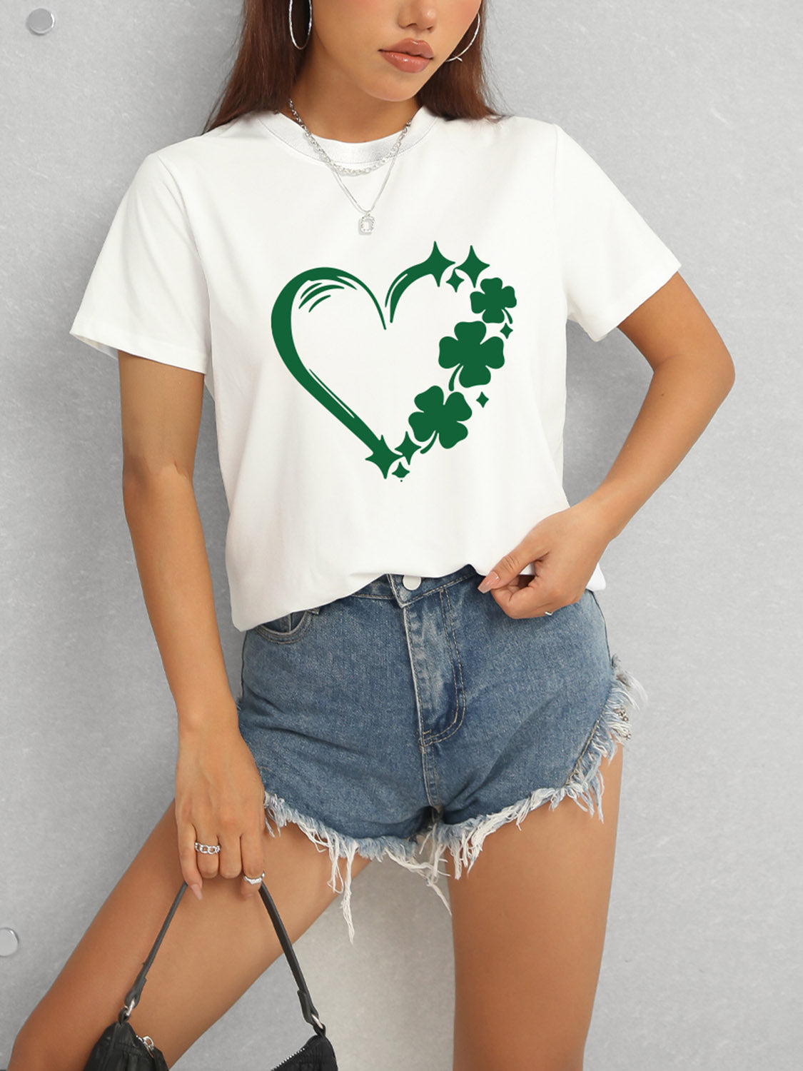 White Heart Lucky Clover T-Shirt and denim shorts