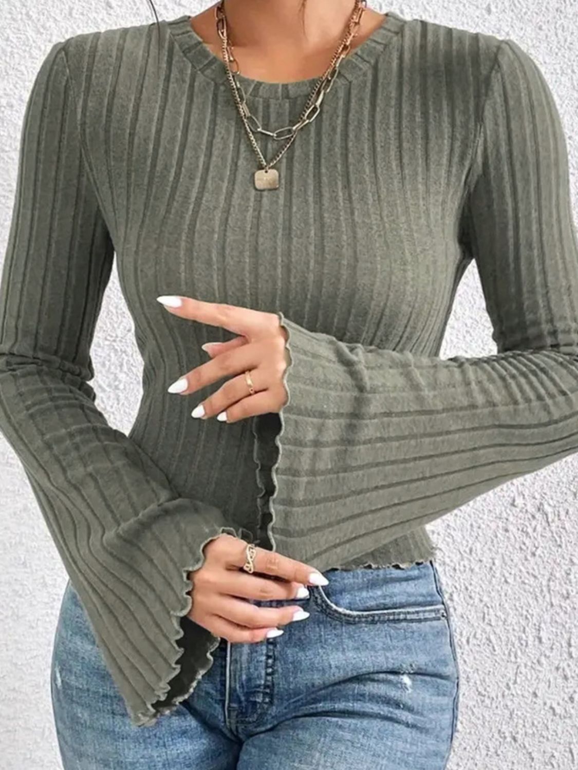 Close-up of green ribbed flare sleeve t-shirt