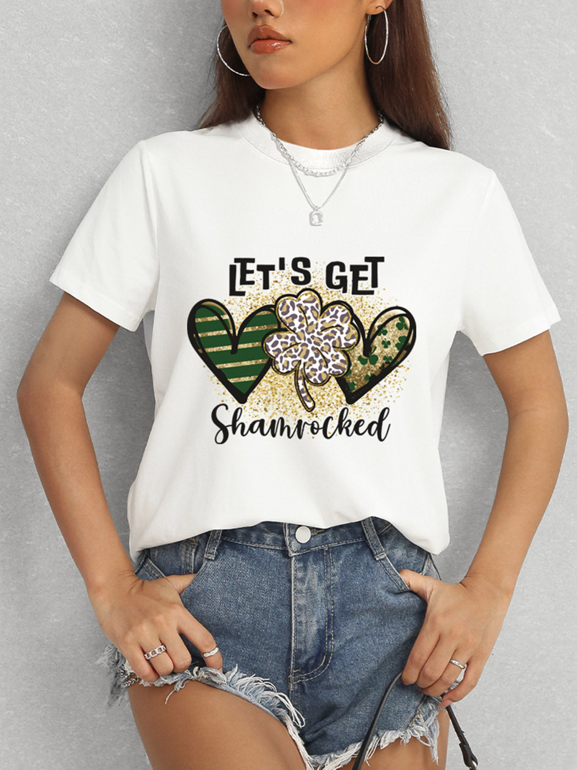 White T-Shirt Featuring Shamrock Design and Denim