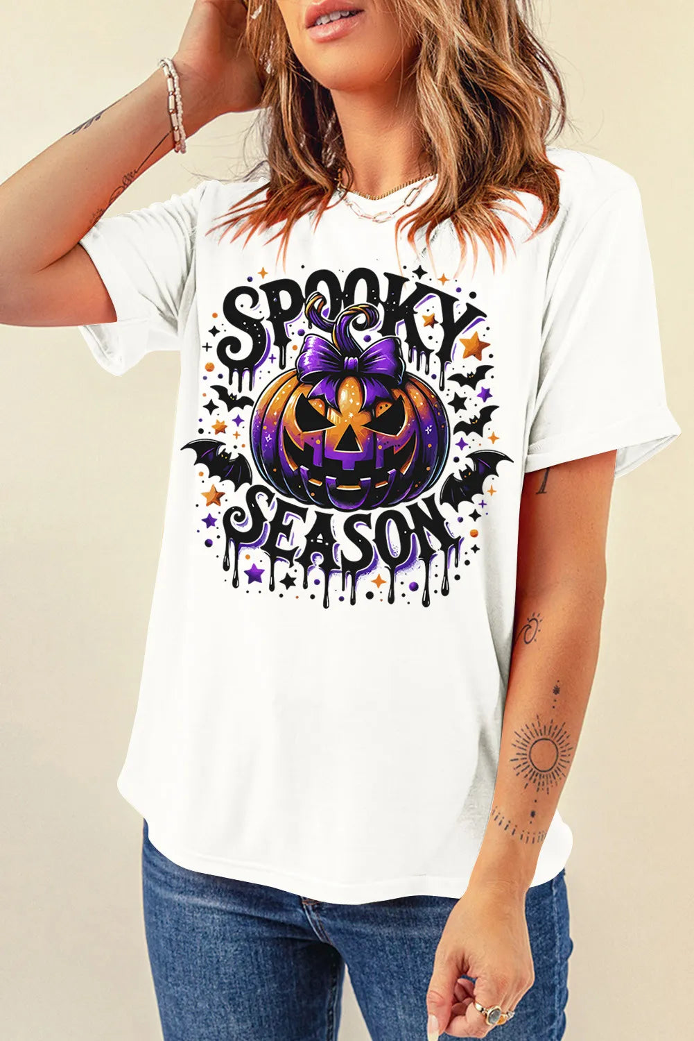 Round neck T-shirt featuring Halloween pumpkin design and text.