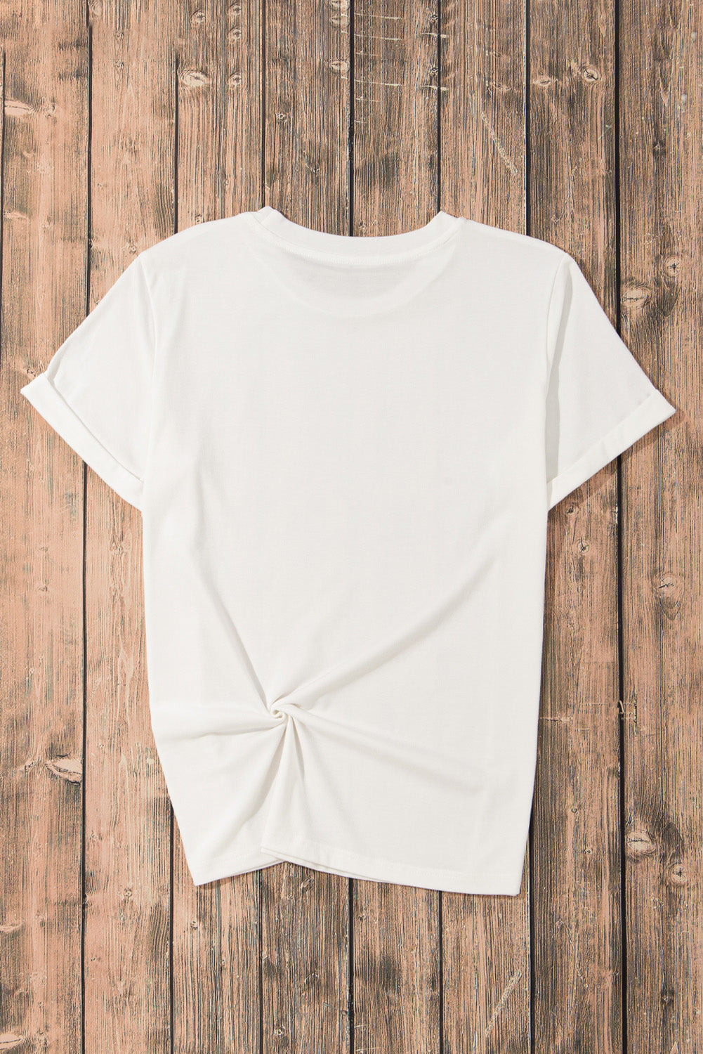 Back view of plain white T-shirt on wooden background