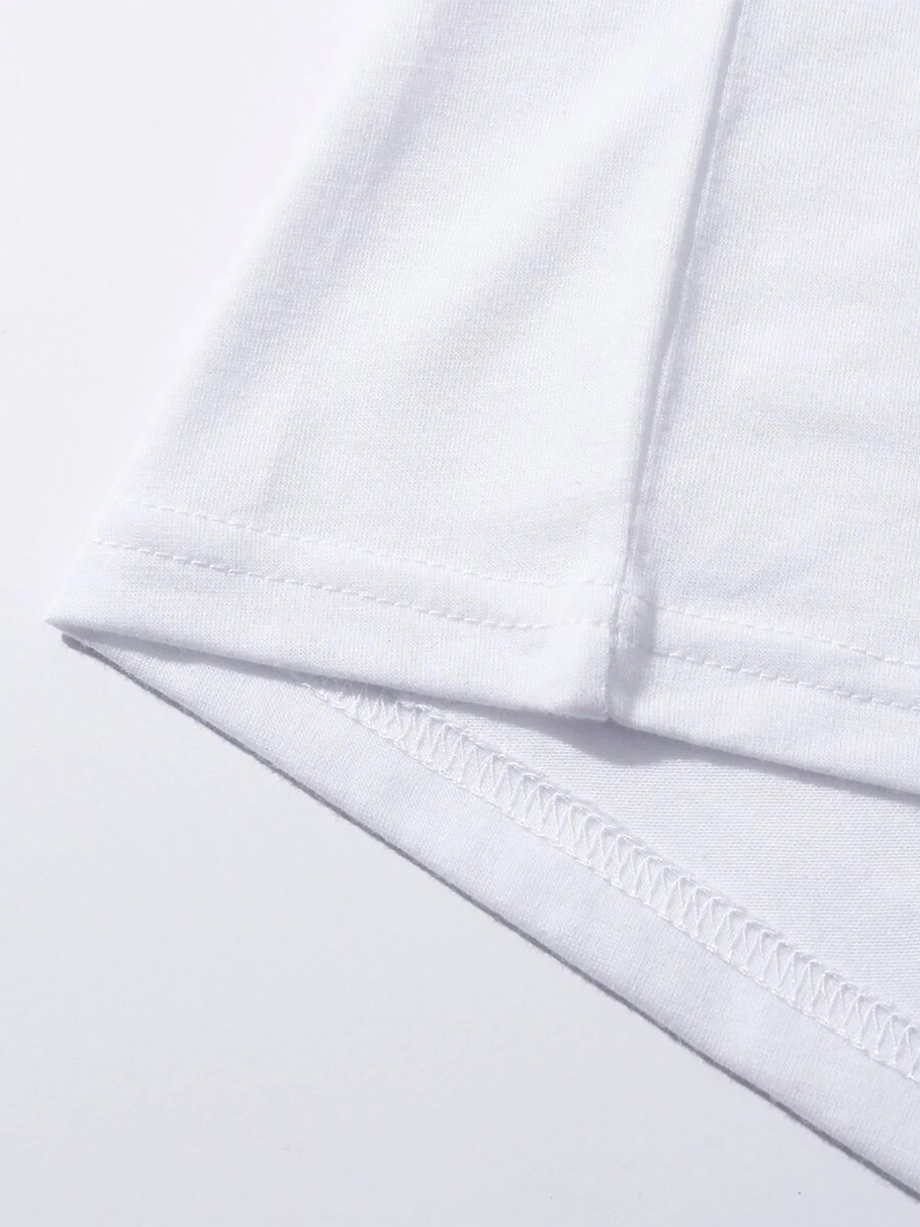 Close-up of white T-shirt stitching detail