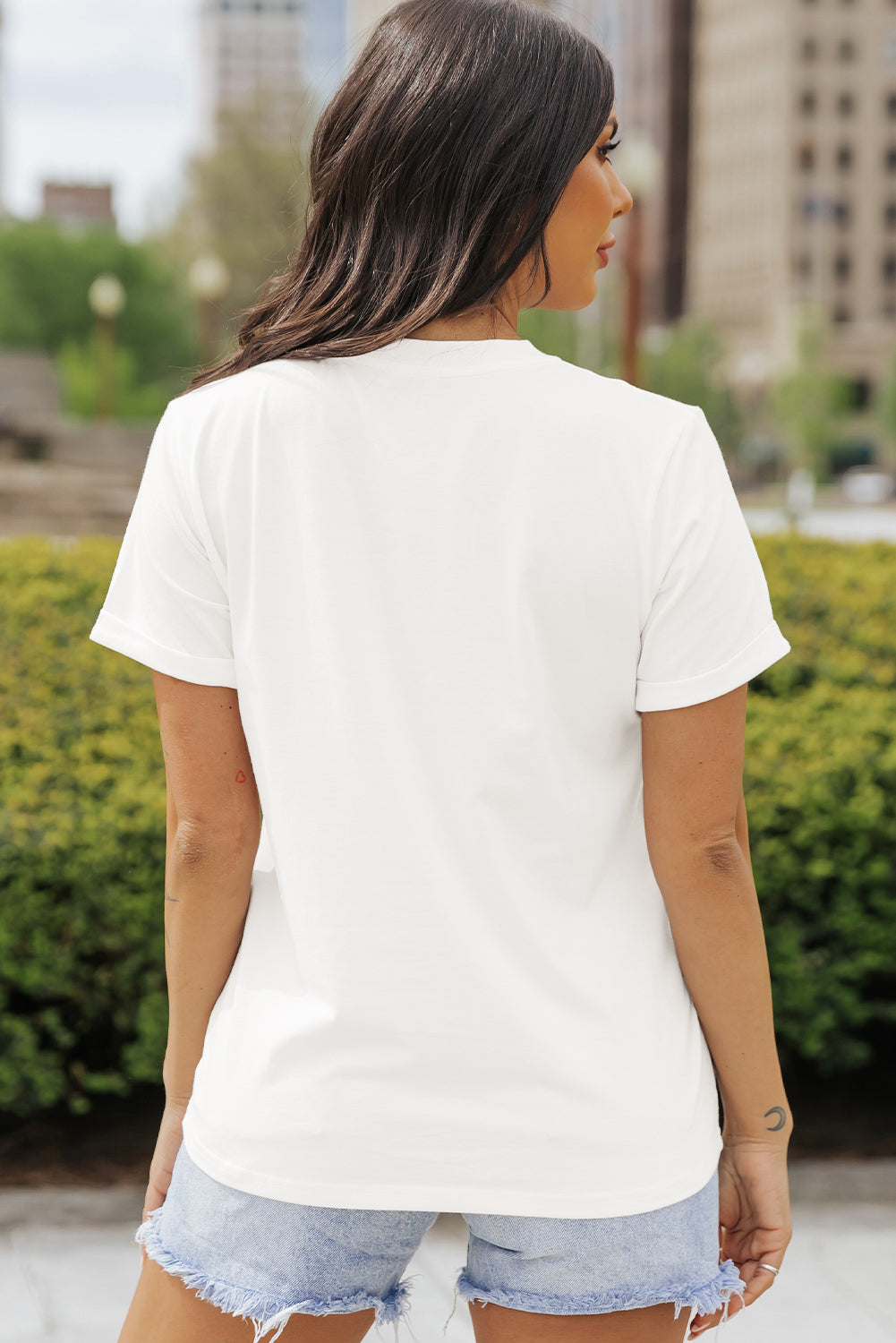 Back view of plain white short sleeve T-shirt.