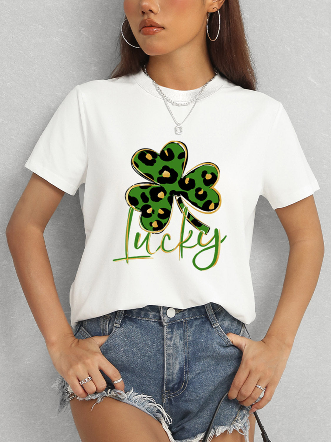 Model wearing white Lucky Clover T-Shirt with shorts