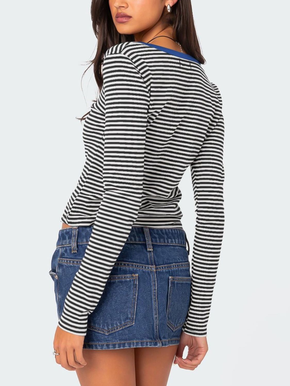 Back view of black and white striped long sleeve T-shirt