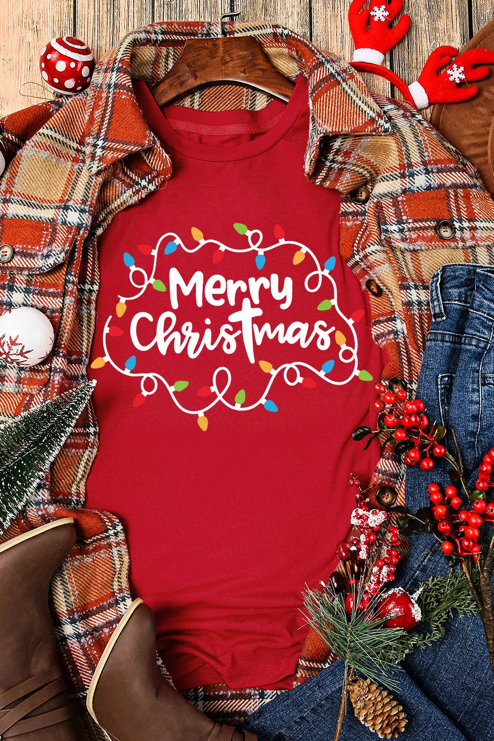 Merry Christmas T-shirt styled with holiday decor.