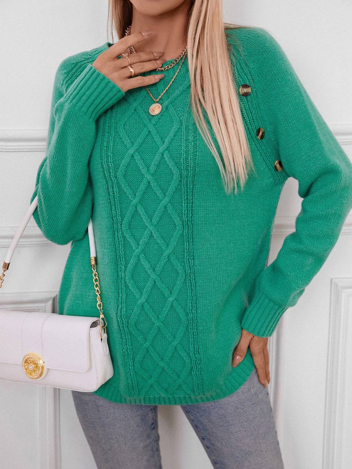 Green sweater styled with white handbag and jewelry
