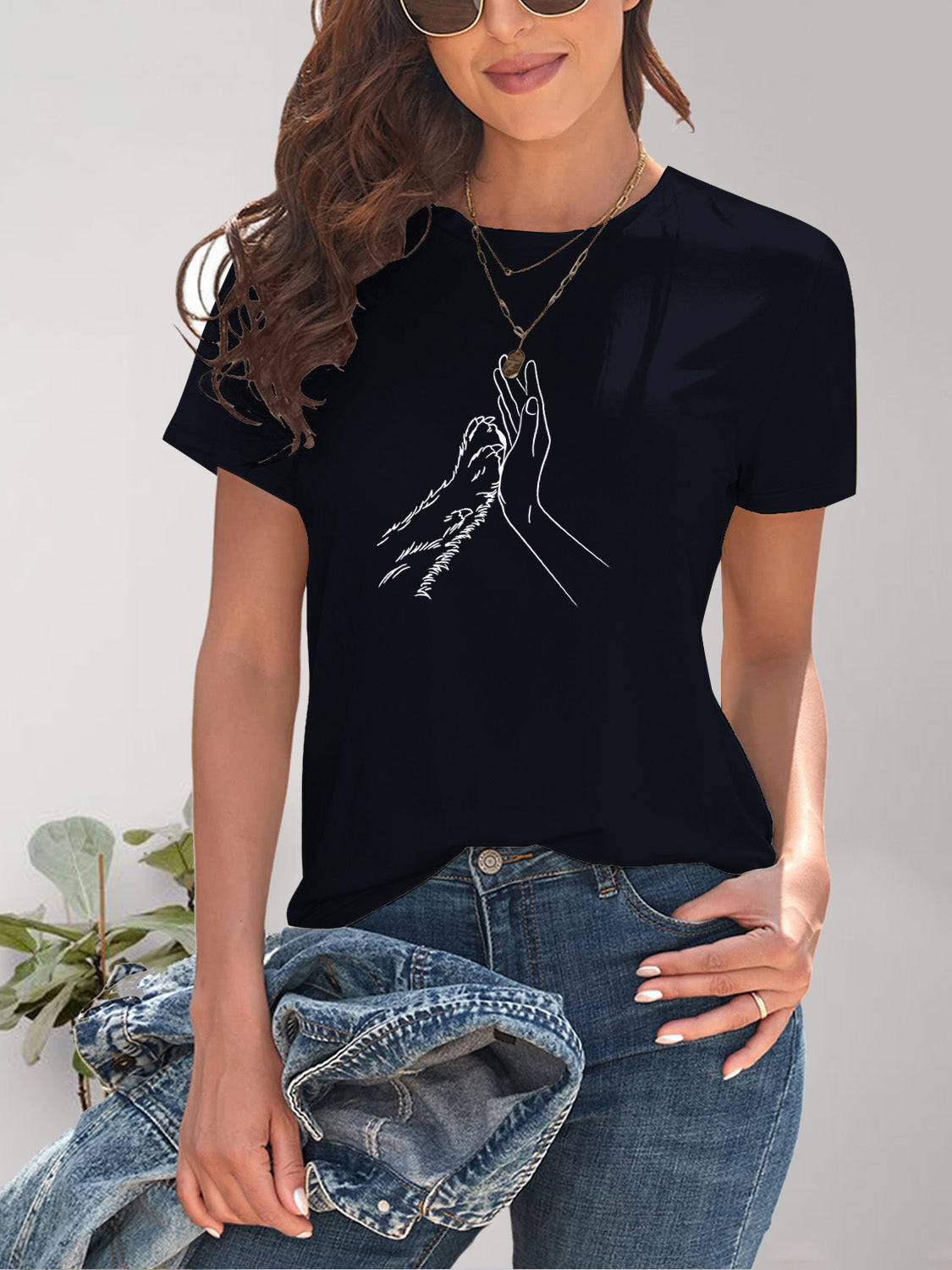 Black T-shirt with hand and paw design
