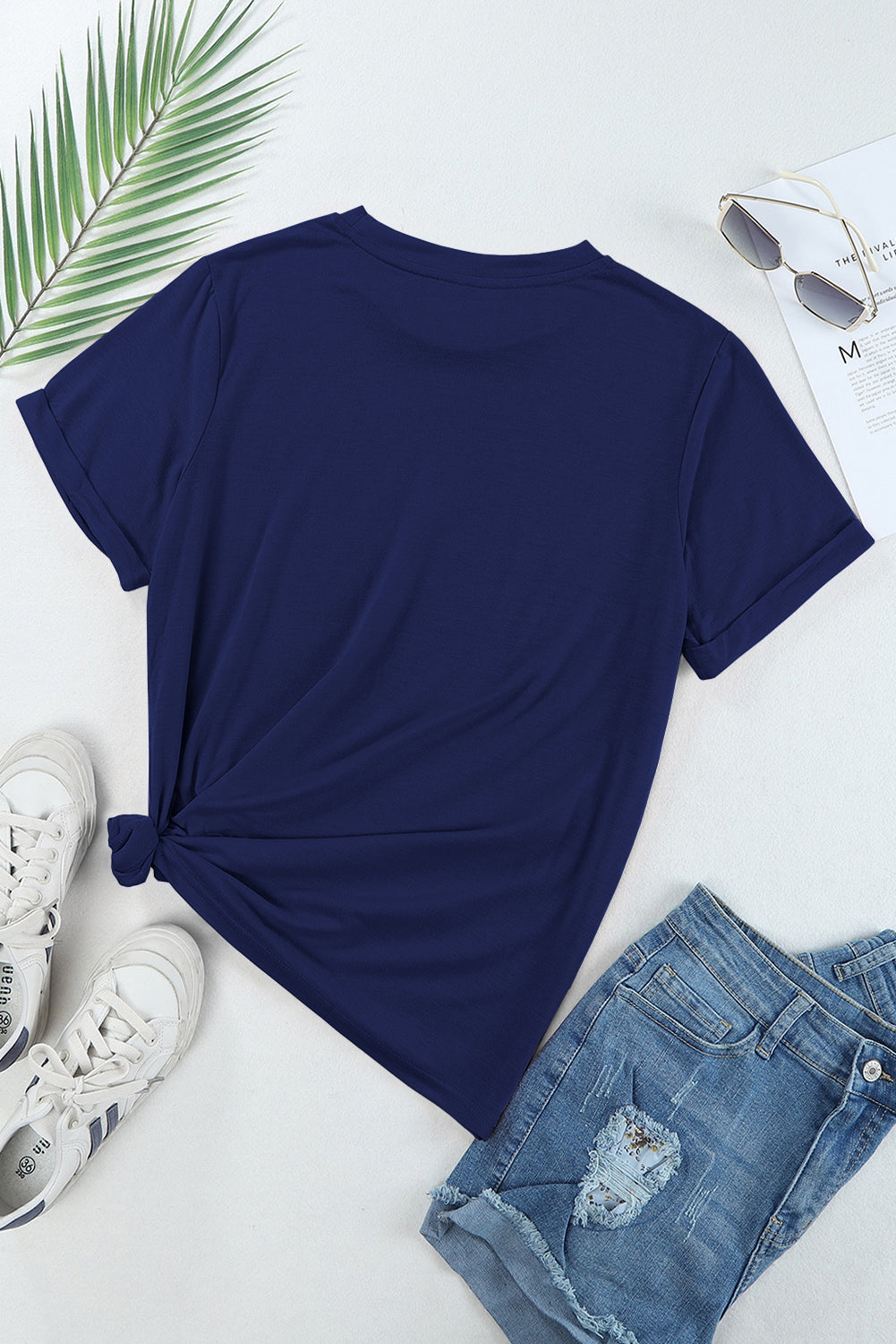 Back of navy T-shirt styled with casual outfit