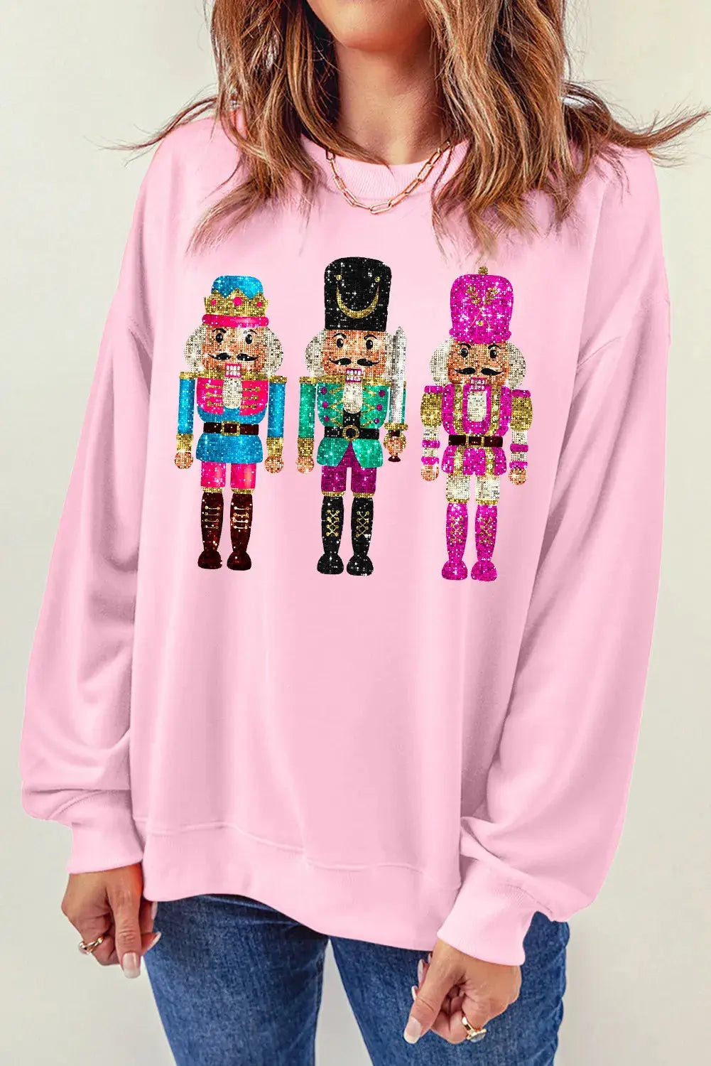 Pink sweatshirt with nutcracker graphic design
