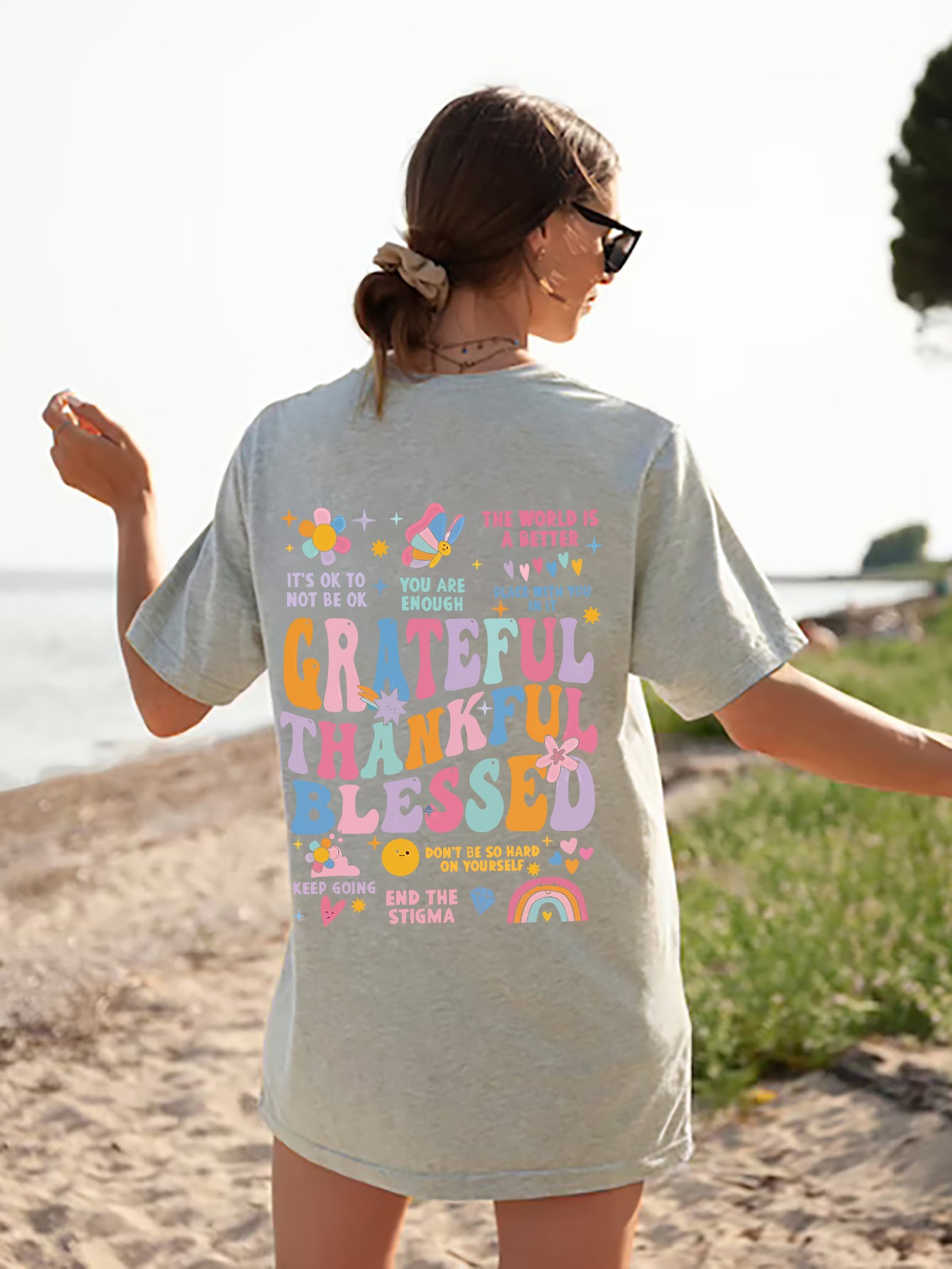 Gray T-shirt with colorful gratitude graphic on back