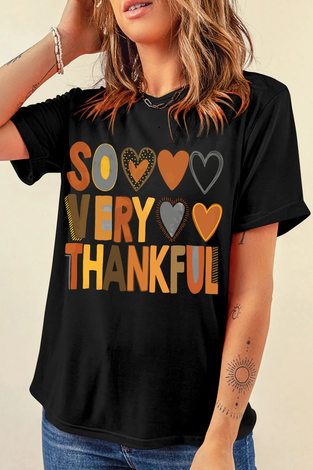 Model wearing black T-shirt with &
