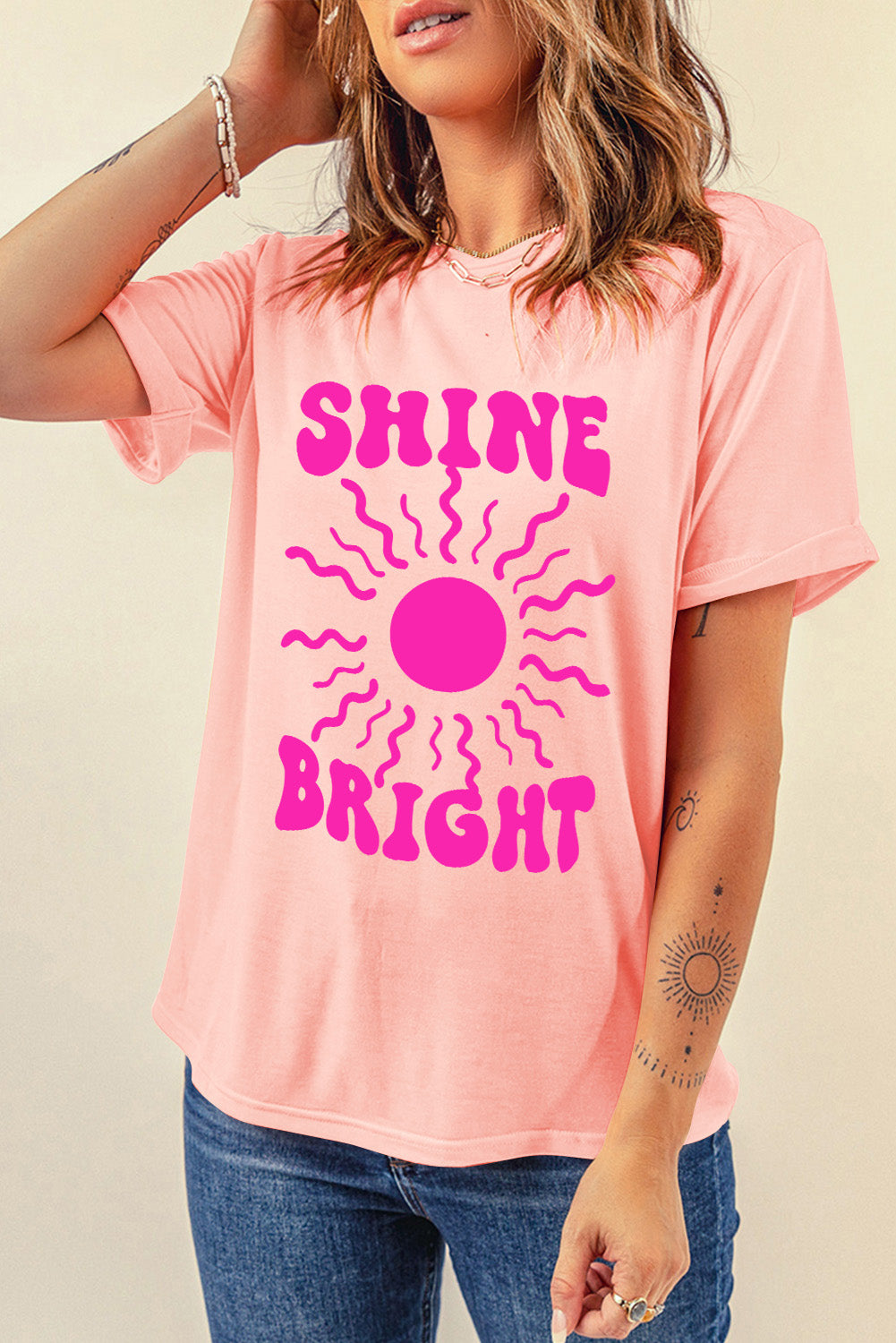 SHINE BRIGHT T-shirt with round neck, arm raised