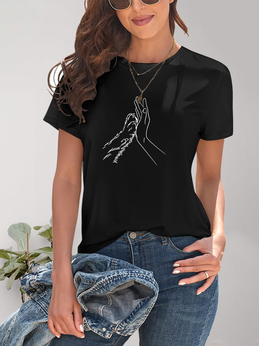 Black graphic T-shirt with hand and paw design