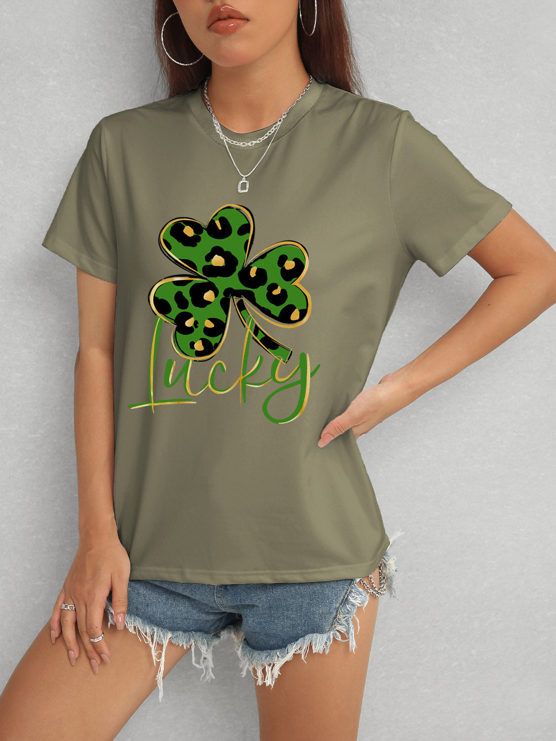 Model wearing olive Lucky Clover T-Shirt with shorts