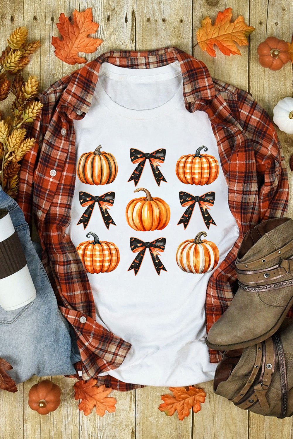 Pumpkin and bow T-shirt styled with plaid shirt and boots.