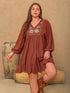 Plus size brown mini dress with embroidered tie neck and balloon sleeves