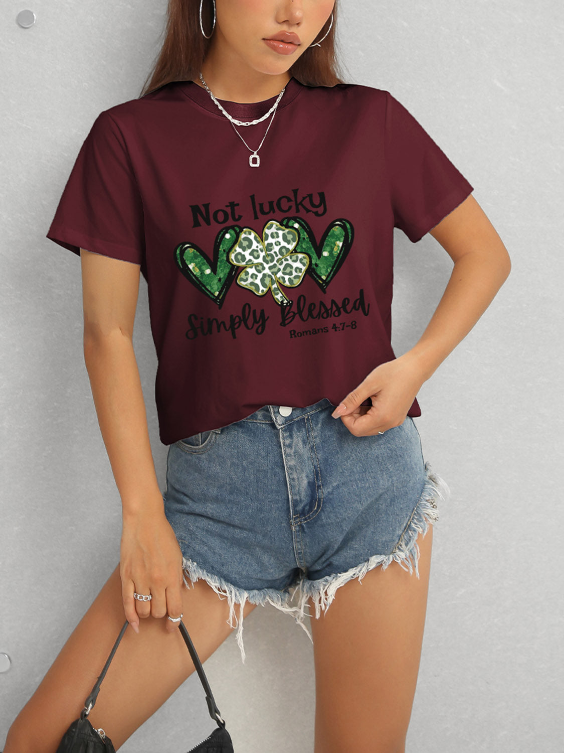Maroon T-shirt with green heart clover design